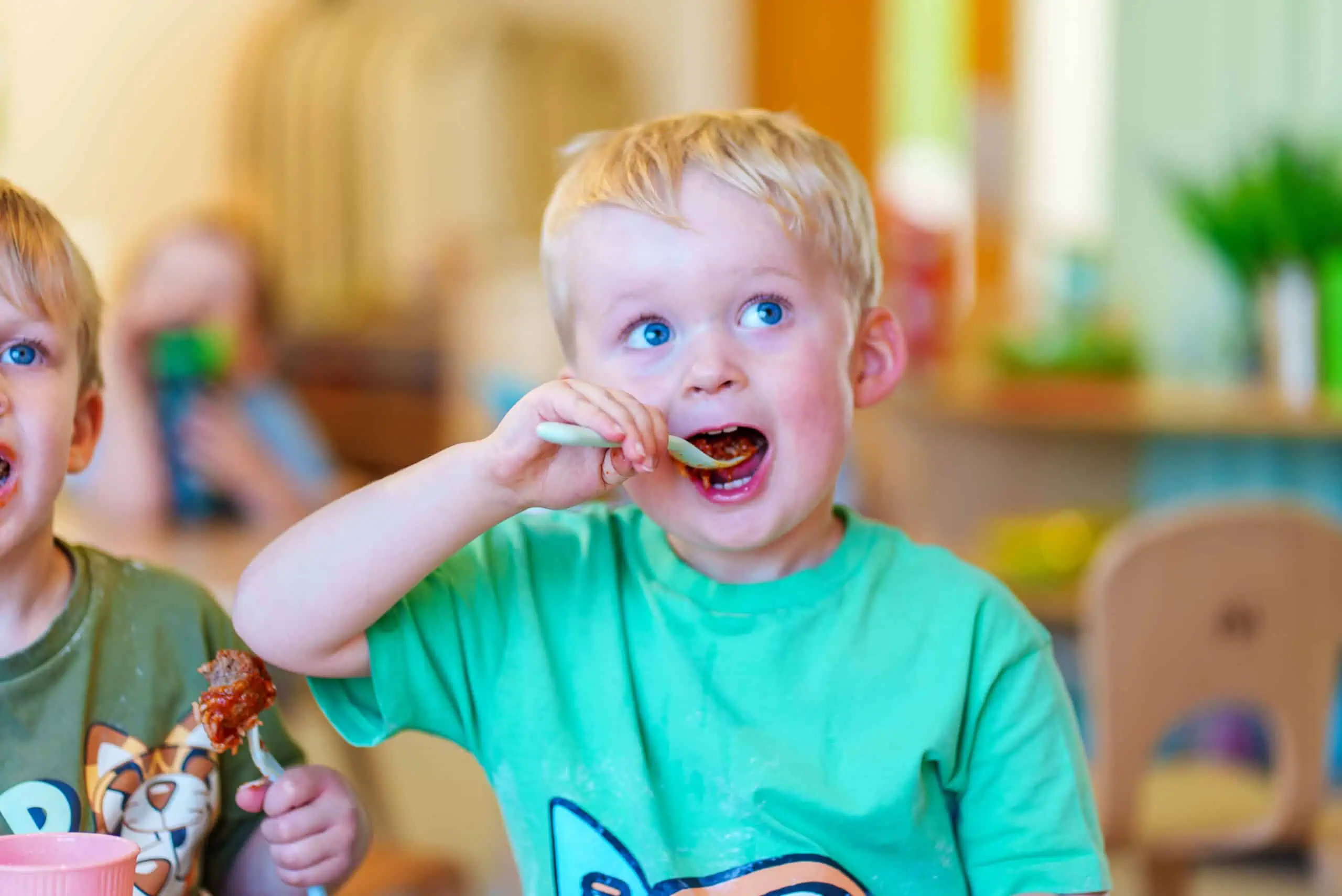 Young Child Eating at Monkey Puzzle Radlett Child enjoying healthy meal at Monkey Puzzle Day Nursery Radlett.