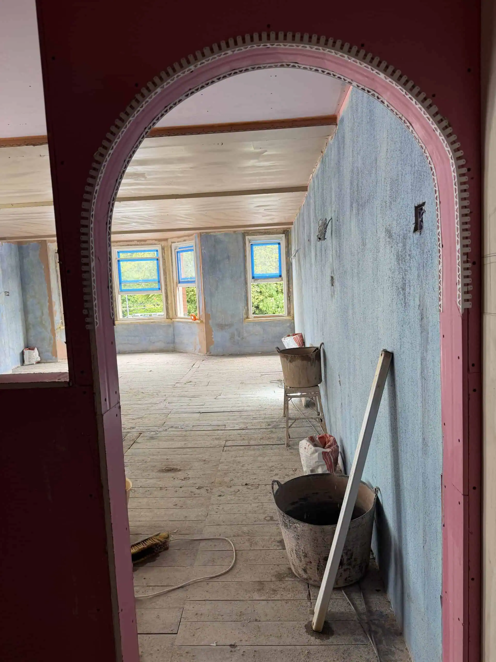 Interior of Monkey Puzzle Radlett nursery under construction with blue walls and windows.